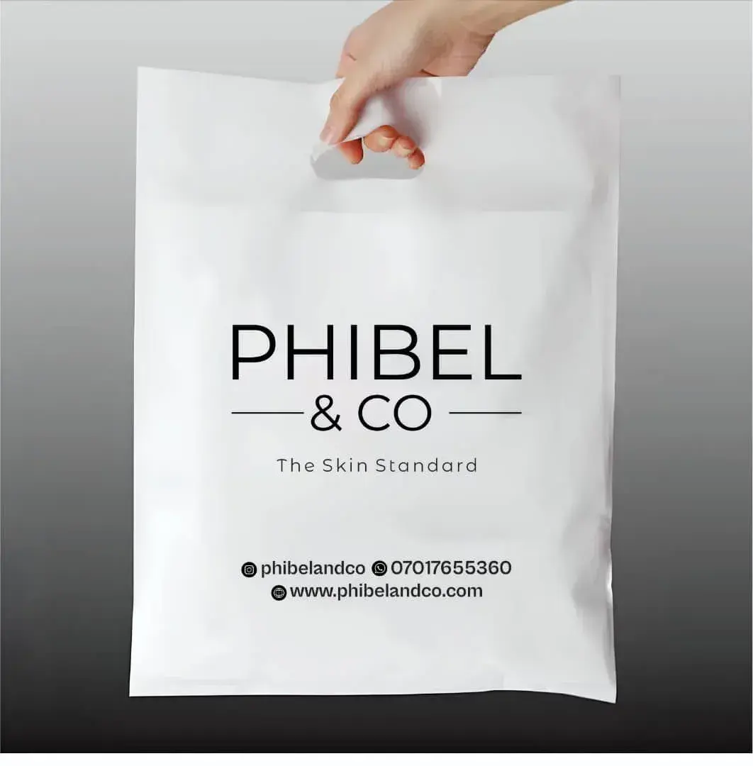 White polybag with a die-cut handle, printed with the Phibel & Co logo in black, for a Nigerian beauty brand